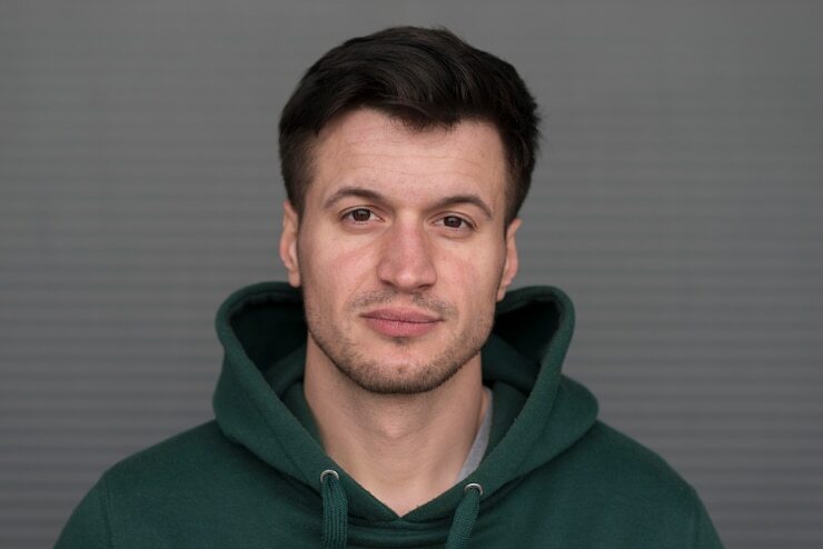 portrait-young-man-with-green-hoodie_23-2148514952